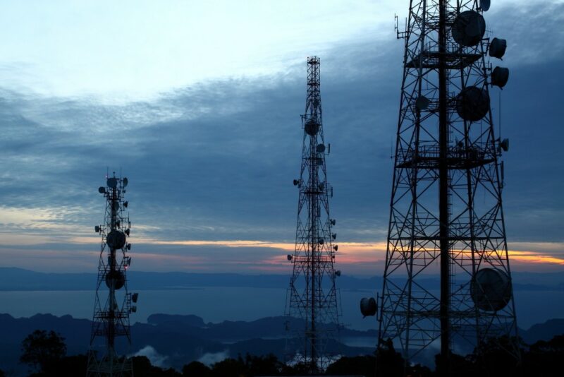 Power lines set against sunset sky